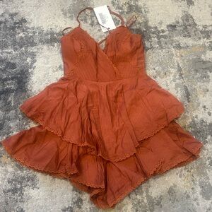 Rust Orange Layered romper size XS (6) 
NWT so cute! Did not fit me.